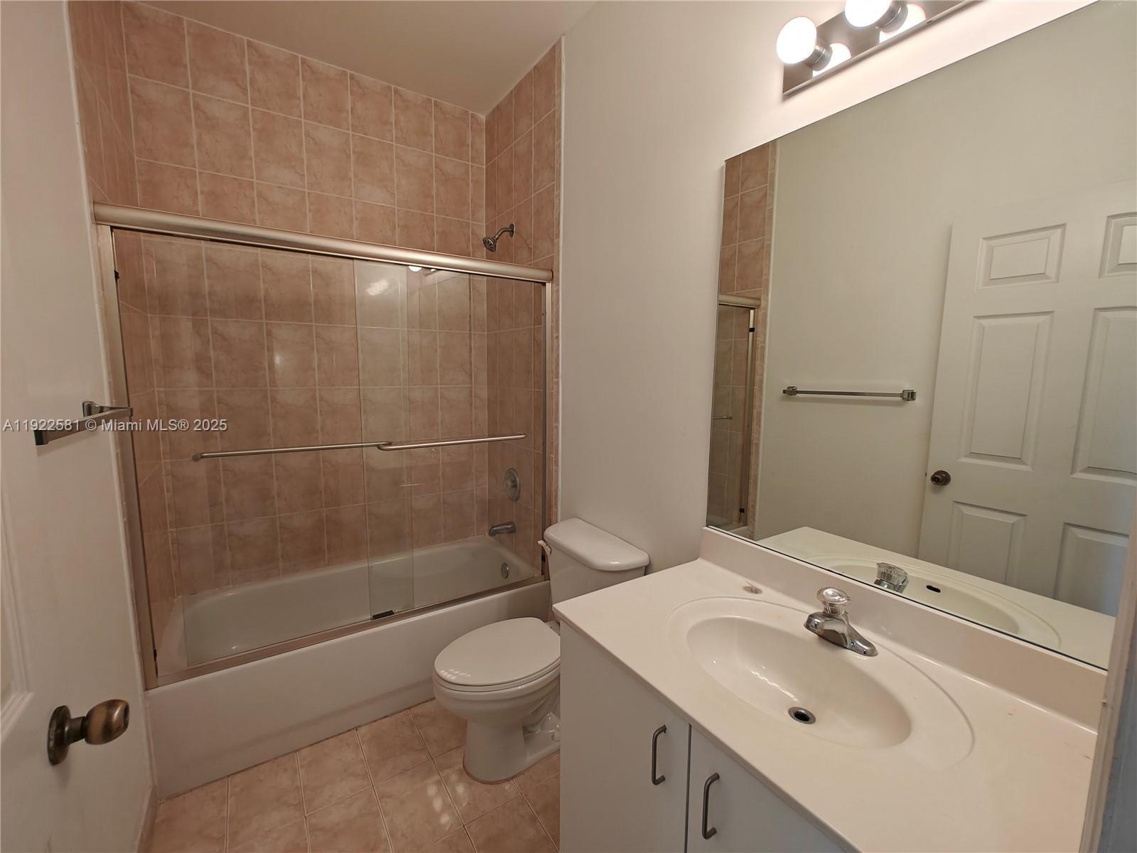 11252 Southwest 230th Terrace, Unit 11252 Miami, FL 33170 - Photo 18 of 28 a bathroom with a sink toilet and shower