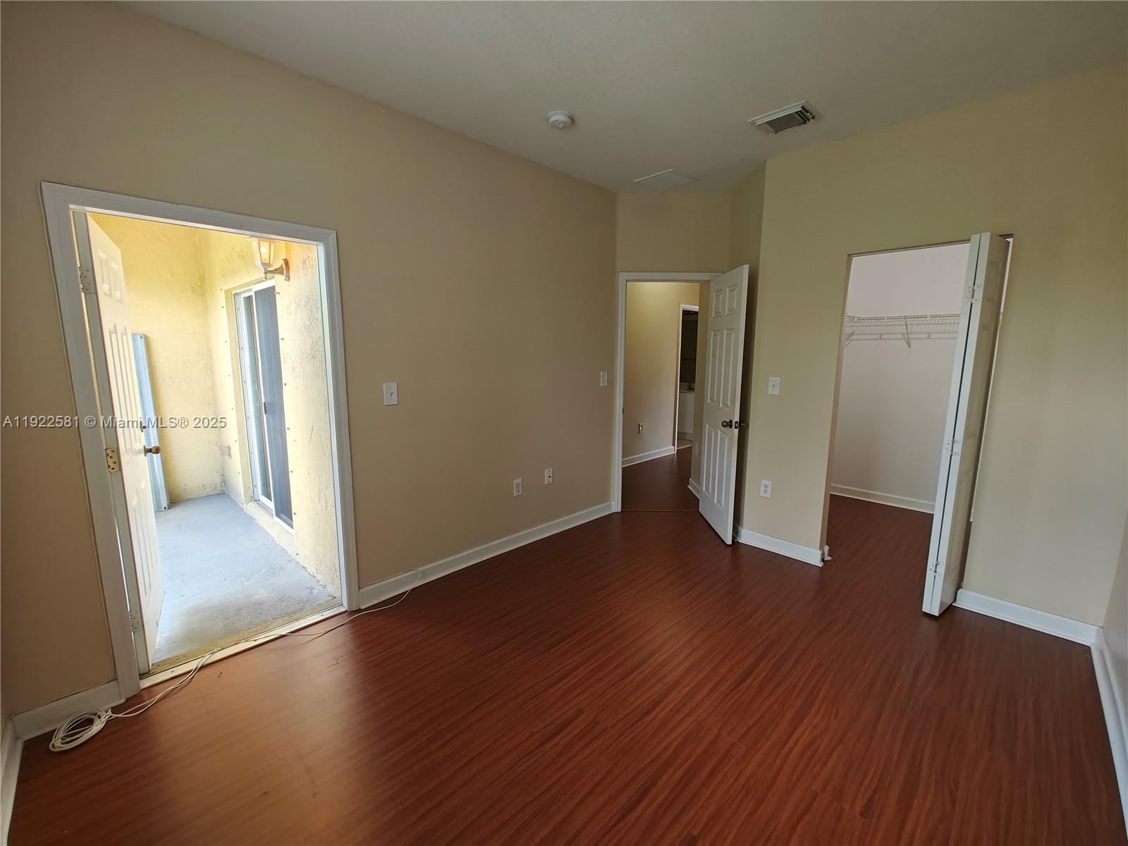 11252 Southwest 230th Terrace, Unit 11252 Miami, FL 33170 - Photo 23 of 28 a view of a hallway with wooden floor