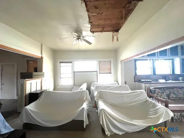 a bed room with a bed and a chandelier