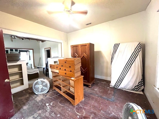 206 Hinton Street Three Rivers, TX 78071 - Photo 18 of 34 a bed room with a bed and a chandelier