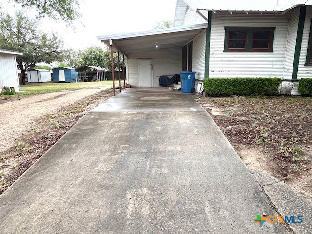 206 Hinton Street Three Rivers, TX 78071 - Photo 3 of 34 a view of a house with backyard and trees