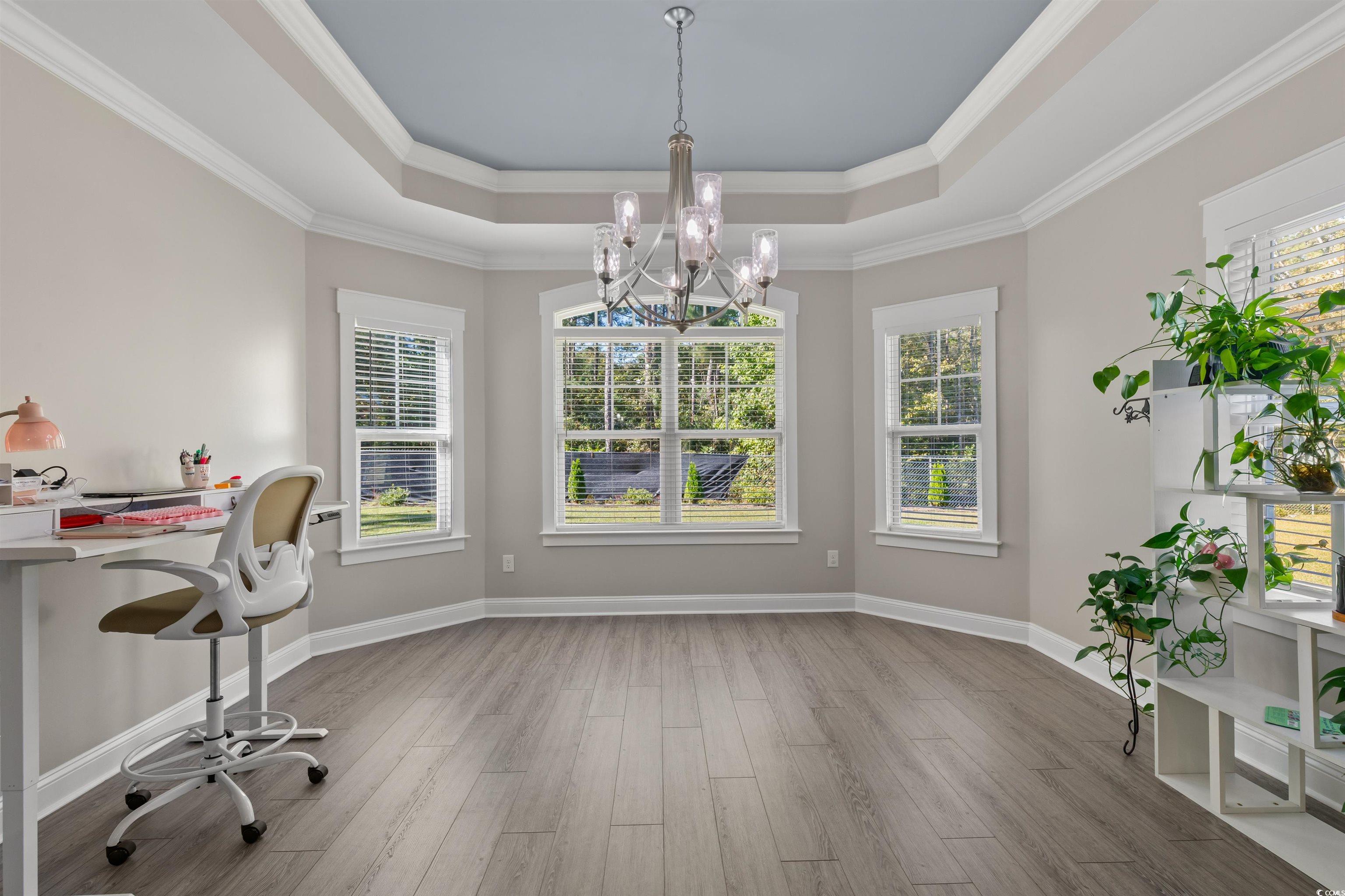3780 Dewitt Road Longs, SC 29568 - Photo 14 of 40 Unfurnished office featuring light wood-style flooring, a chandelier, a raised ceiling, and crown molding