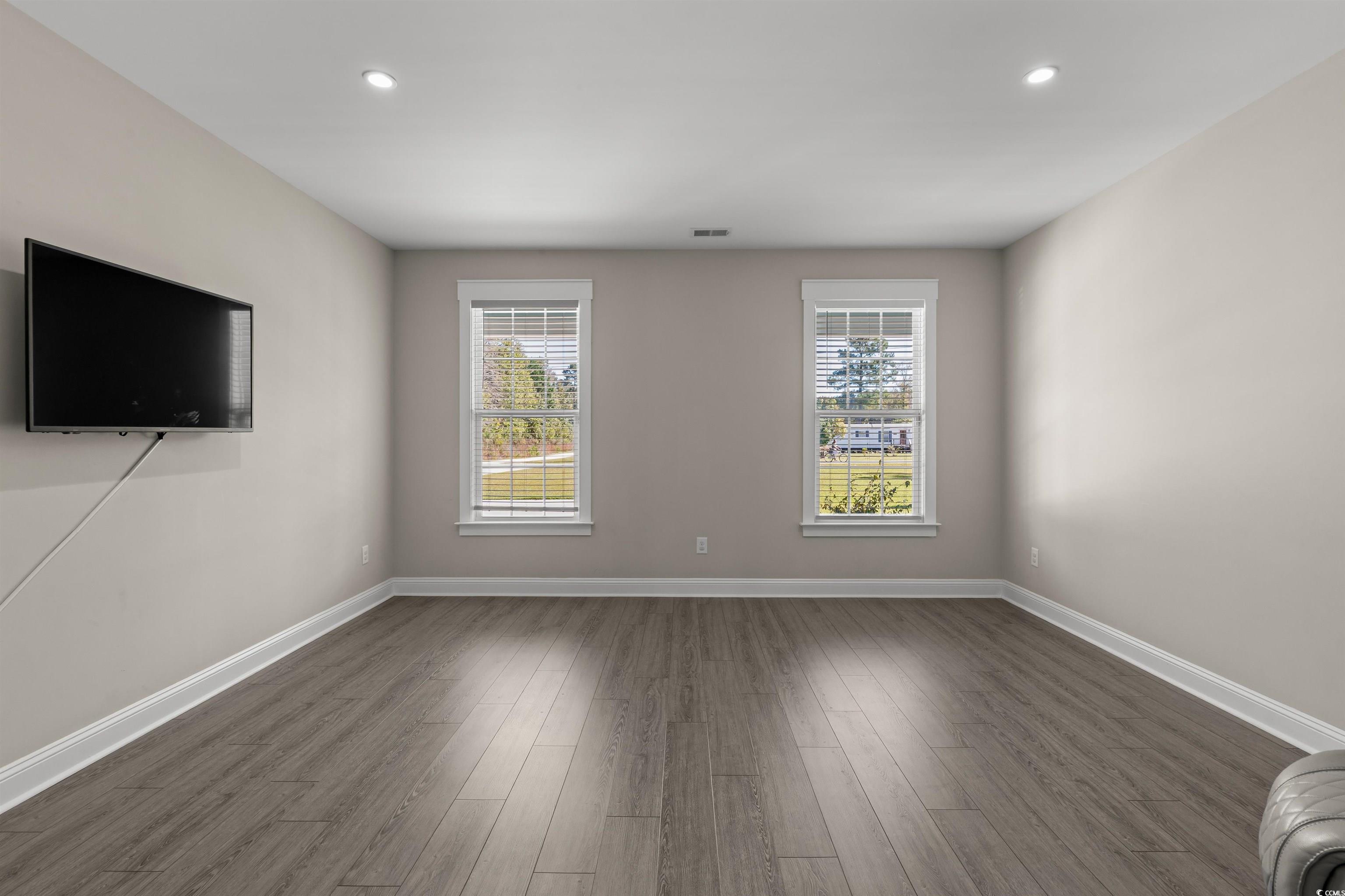 3780 Dewitt Road Longs, SC 29568 - Photo 15 of 40 Unfurnished living room featuring healthy amount of natural light, wood finished floors, and recessed lighting