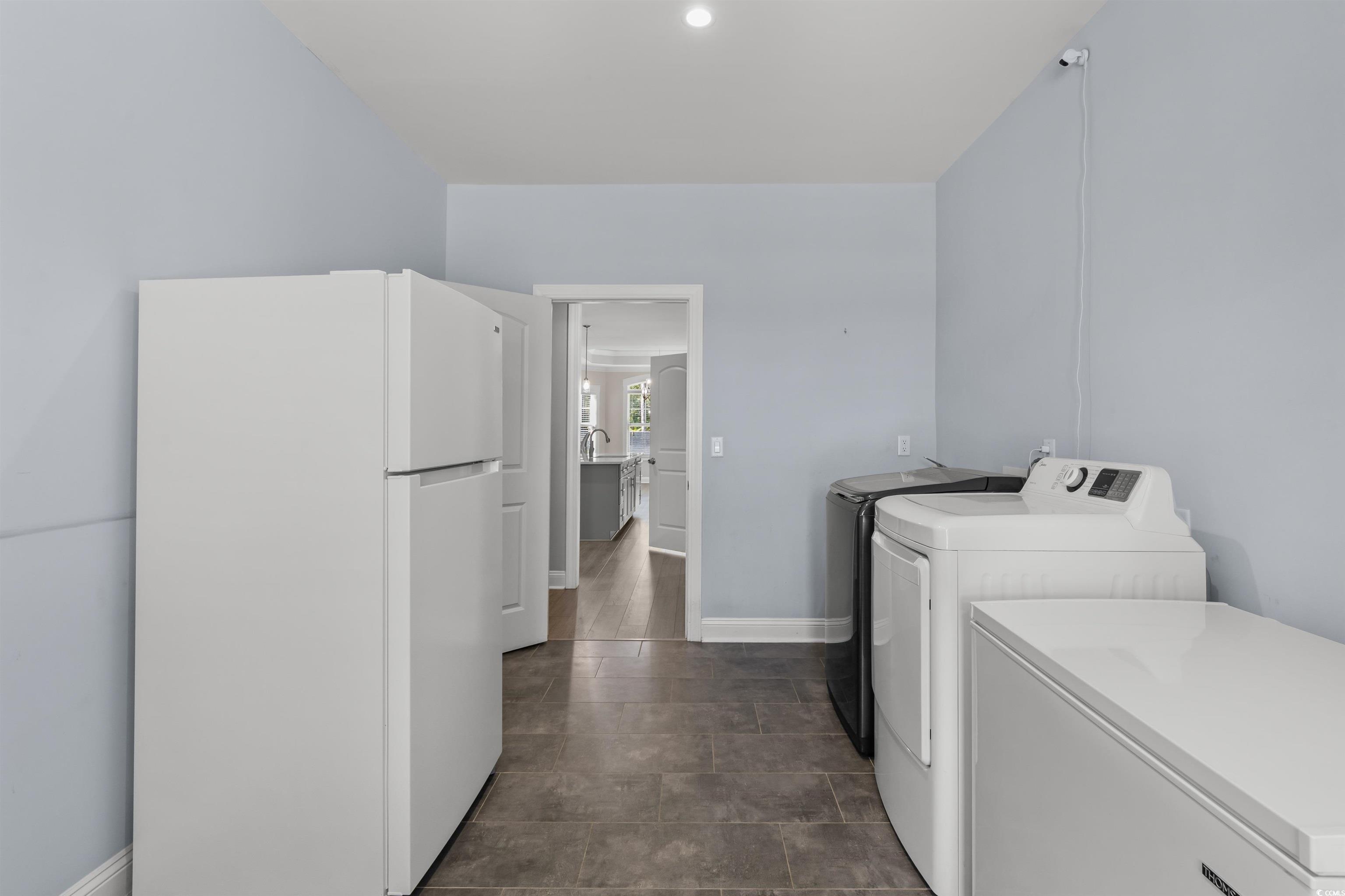3780 Dewitt Road Longs, SC 29568 - Photo 26 of 40 Laundry area featuring washing machine and clothes dryer and baseboards