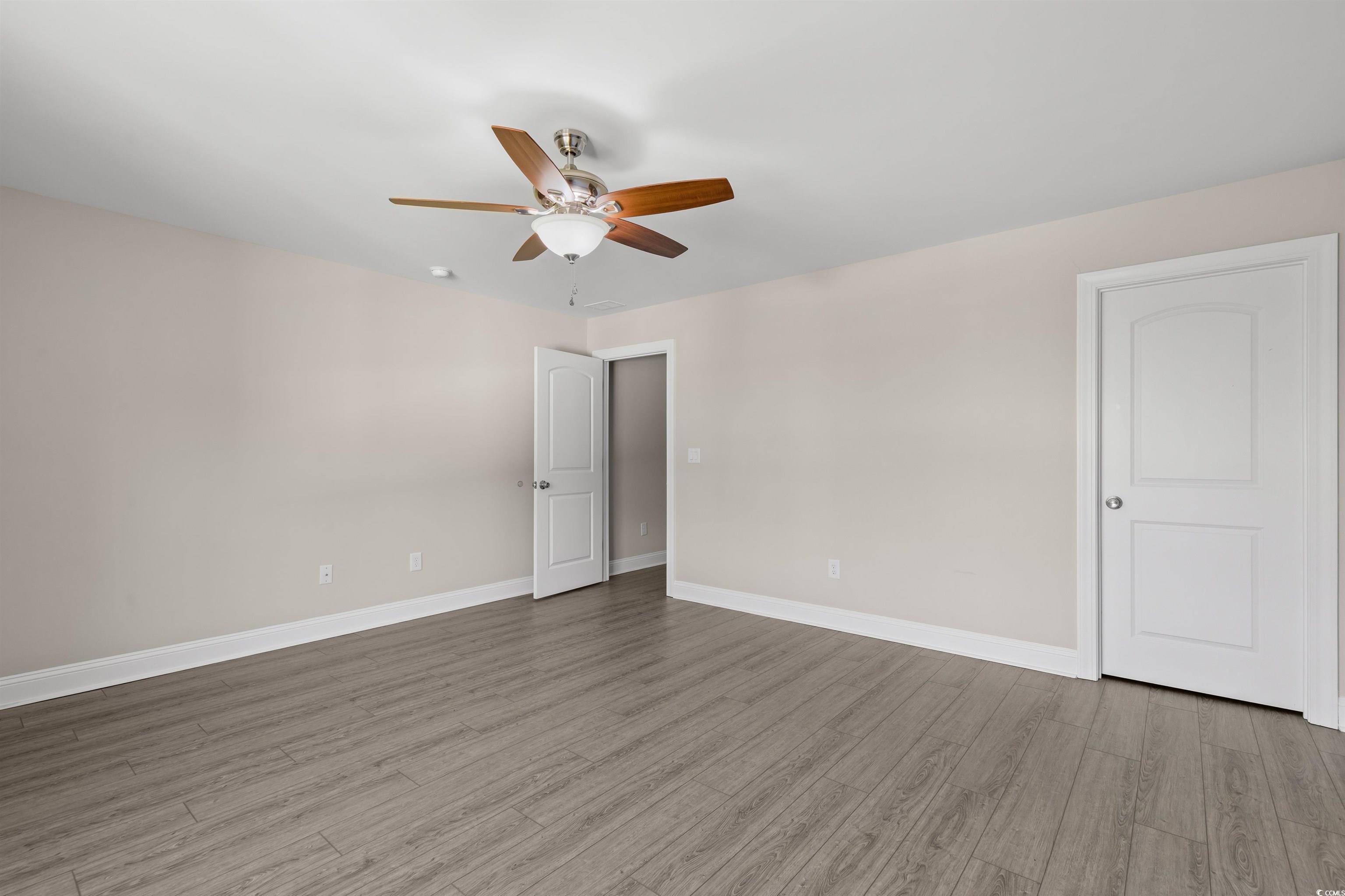3780 Dewitt Road Longs, SC 29568 - Photo 29 of 40 Unfurnished bedroom featuring wood finished floors and ceiling fan