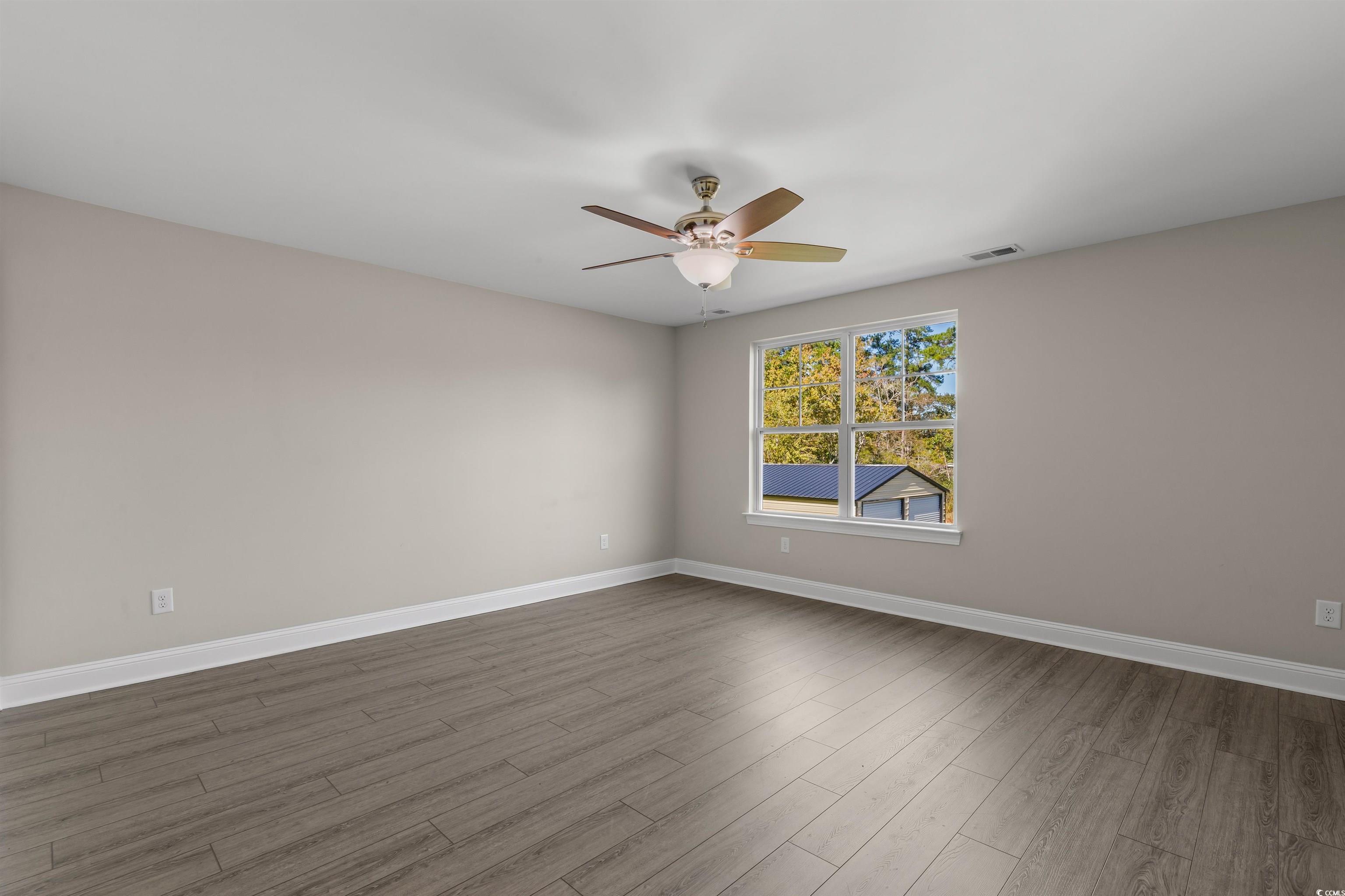 3780 Dewitt Road Longs, SC 29568 - Photo 30 of 40 Unfurnished room with light wood finished floors and ceiling fan