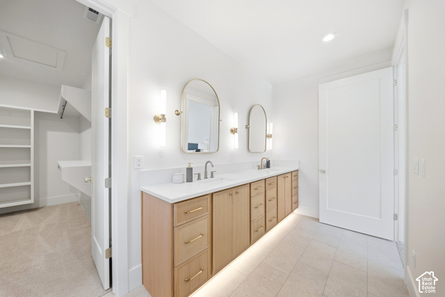 4092 Discovery Way Park City, UT 84098 - Photo 33 of 66 Dual vanity with wood-finish cabinetry, under-cabinet lighting, and white countertops