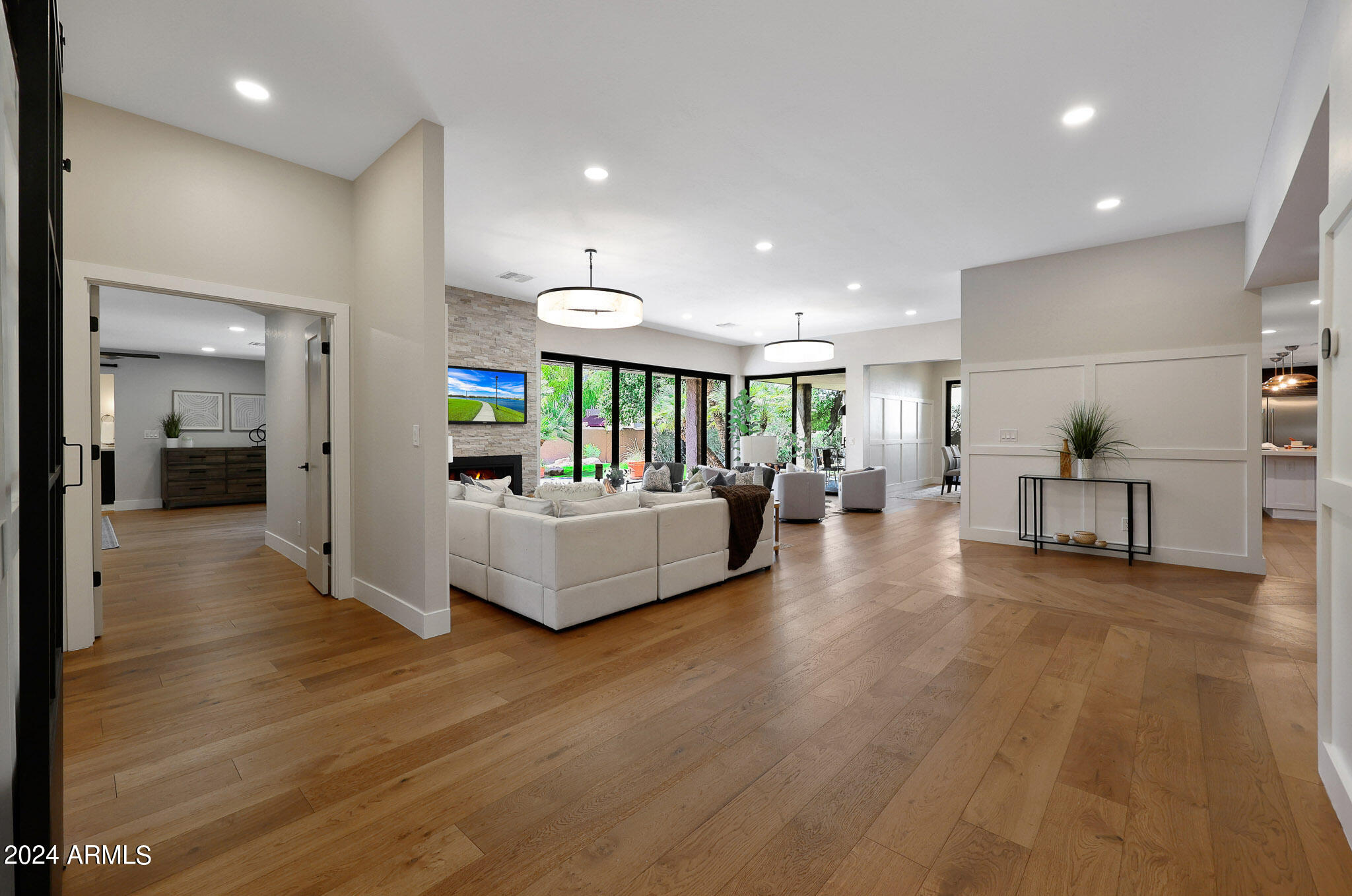 4440 East Camelback Road, Unit 32 Phoenix, AZ 85018 - Photo 11 of 54 a living room with furniture and a wooden floor