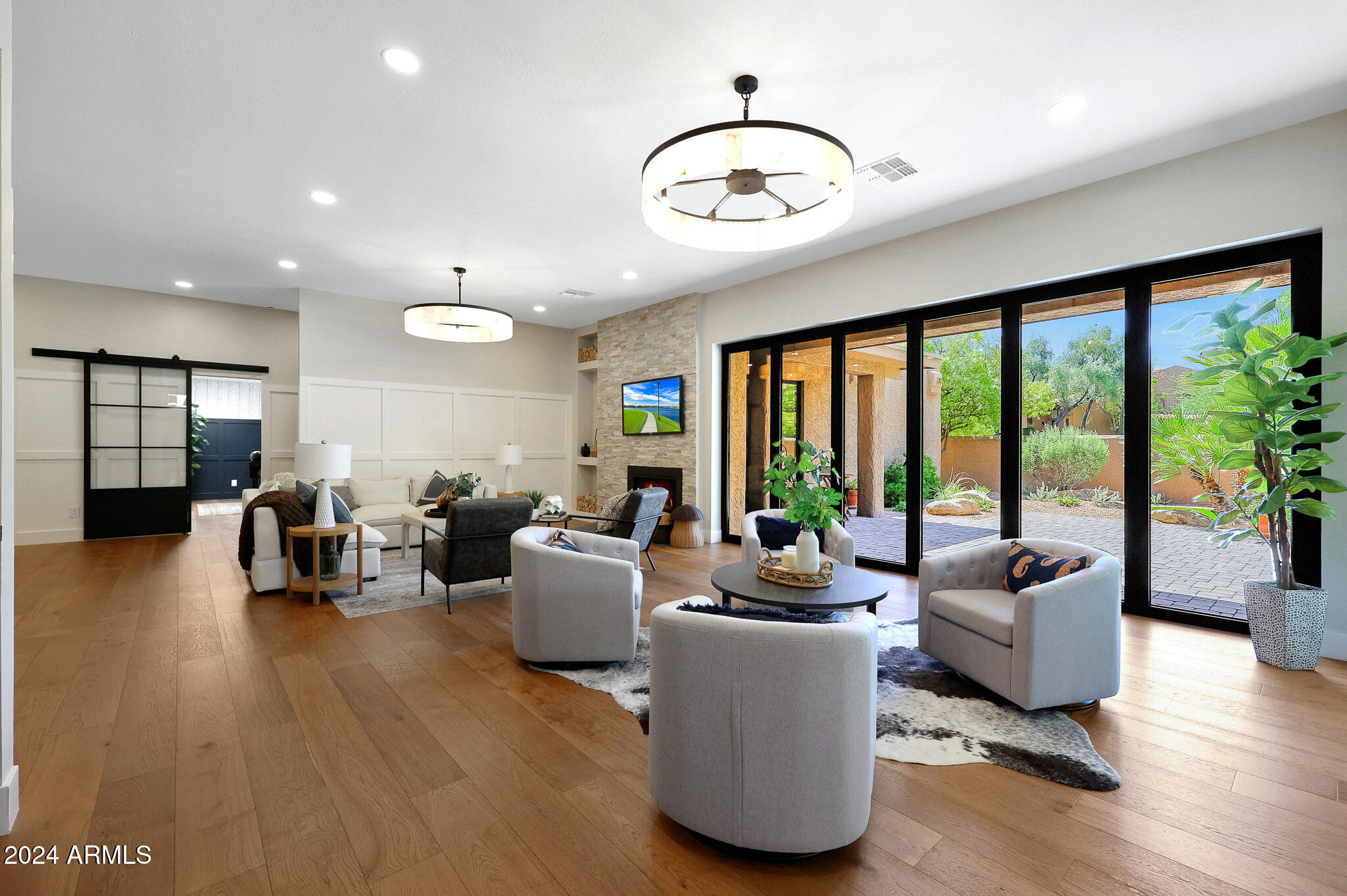 4440 East Camelback Road, Unit 32 Phoenix, AZ 85018 - Photo 12 of 54 a living room with furniture and a large window