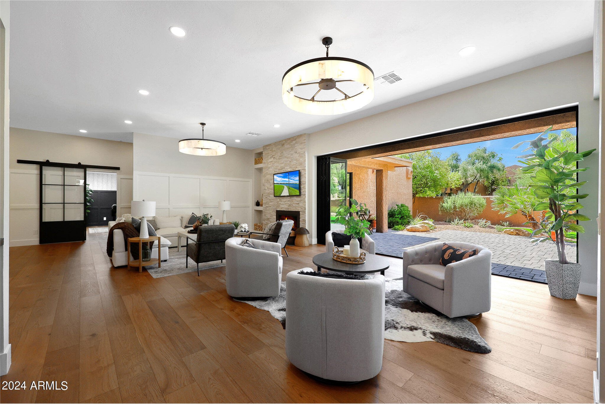 4440 East Camelback Road, Unit 32 Phoenix, AZ 85018 - Photo 13 of 54 a living room with fireplace furniture and a large window