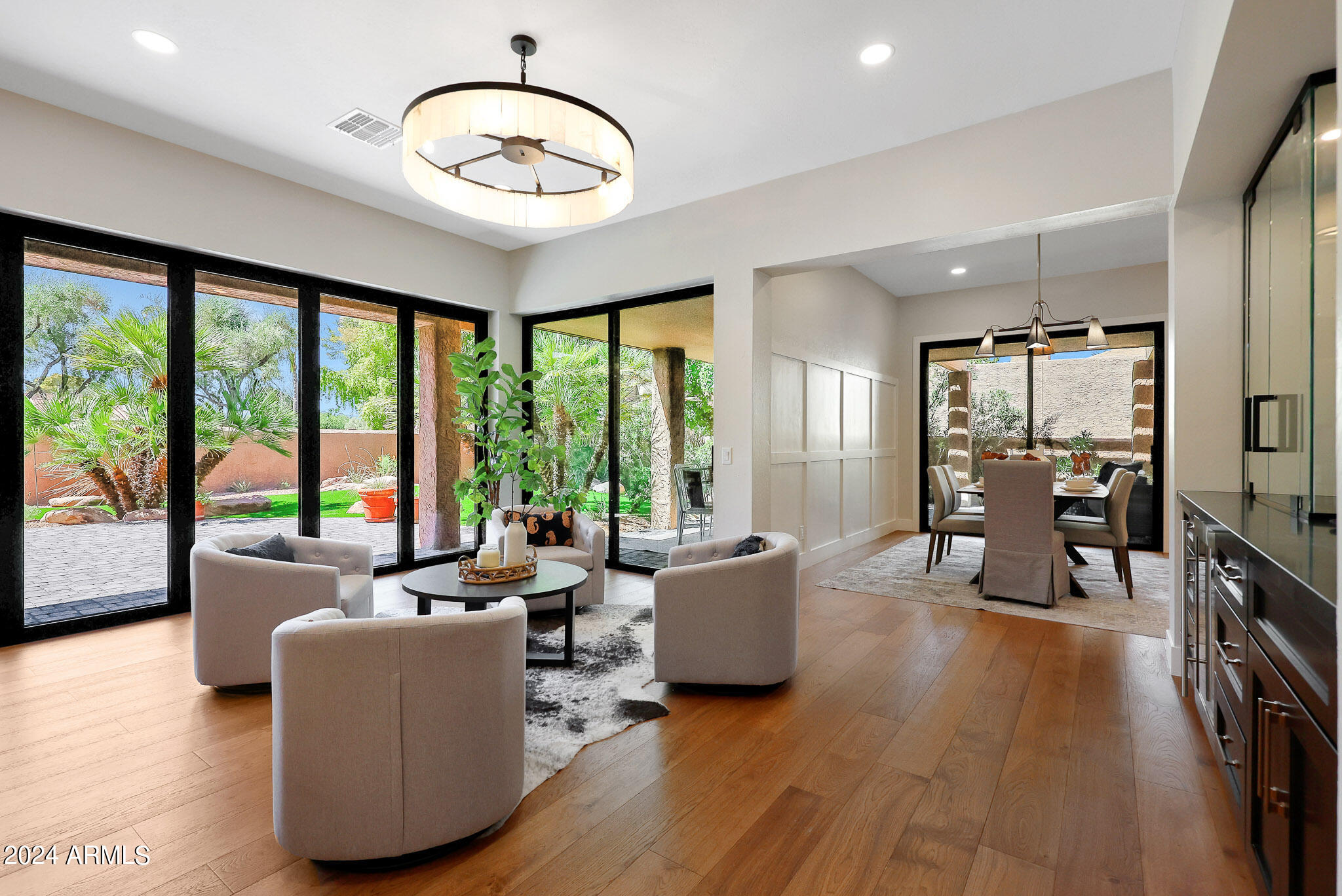 4440 East Camelback Road, Unit 32 Phoenix, AZ 85018 - Photo 16 of 54 a living room with furniture and a large window