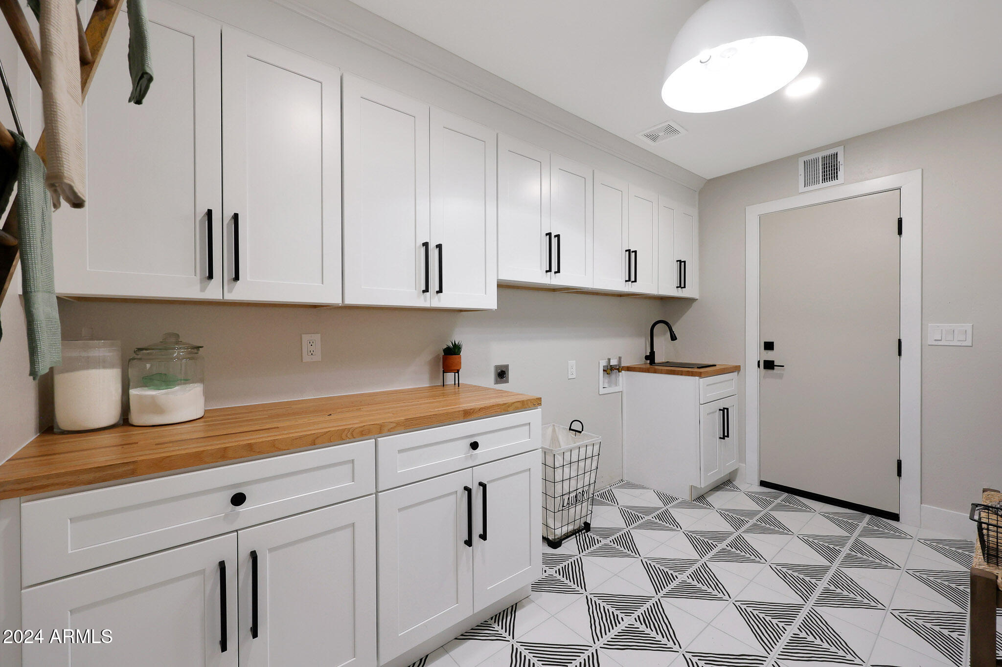 4440 East Camelback Road, Unit 32 Phoenix, AZ 85018 - Photo 23 of 54 a view of a kitchen with appliances and cabinets