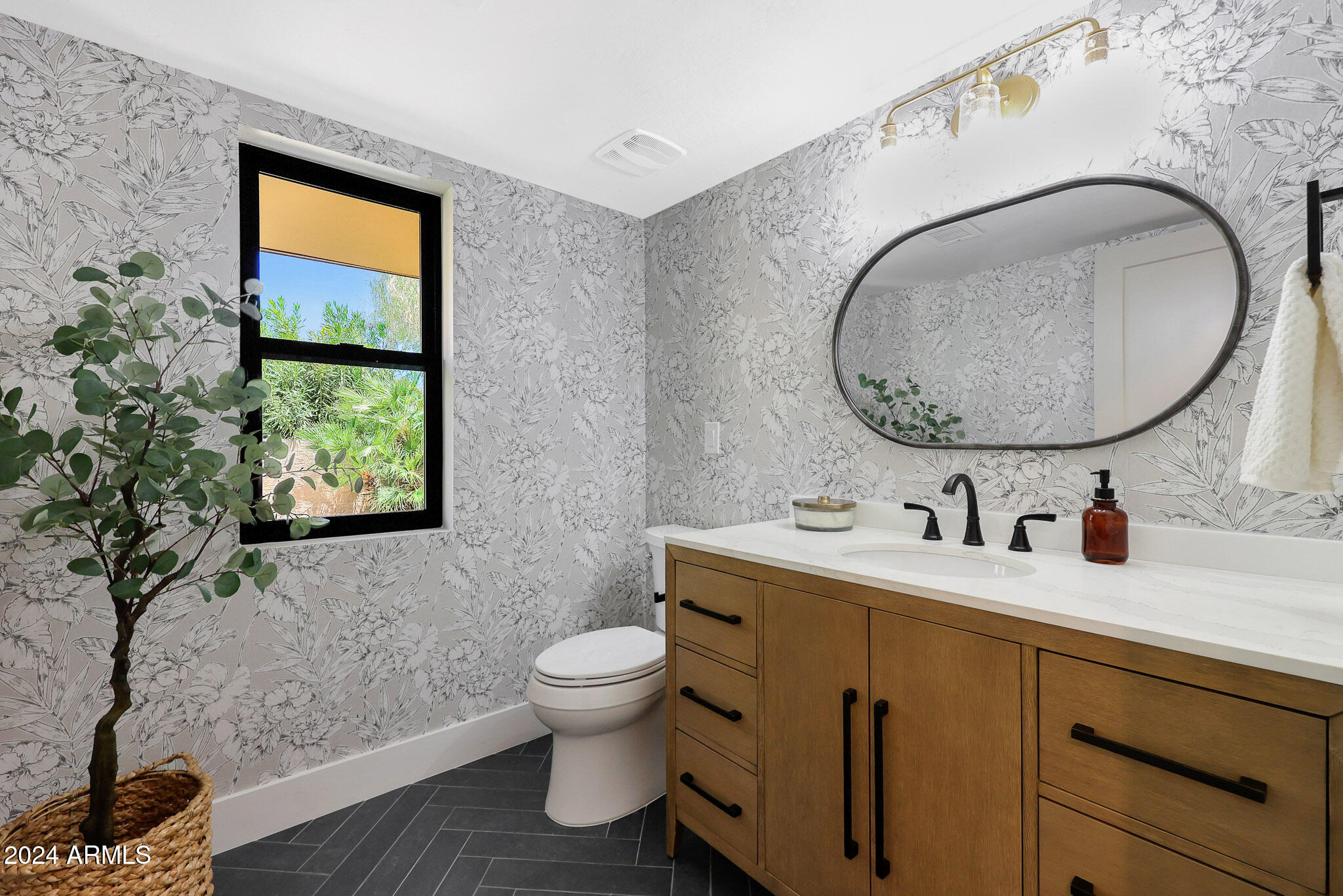 4440 East Camelback Road, Unit 32 Phoenix, AZ 85018 - Photo 24 of 54 a bathroom with a toilet sink and mirror