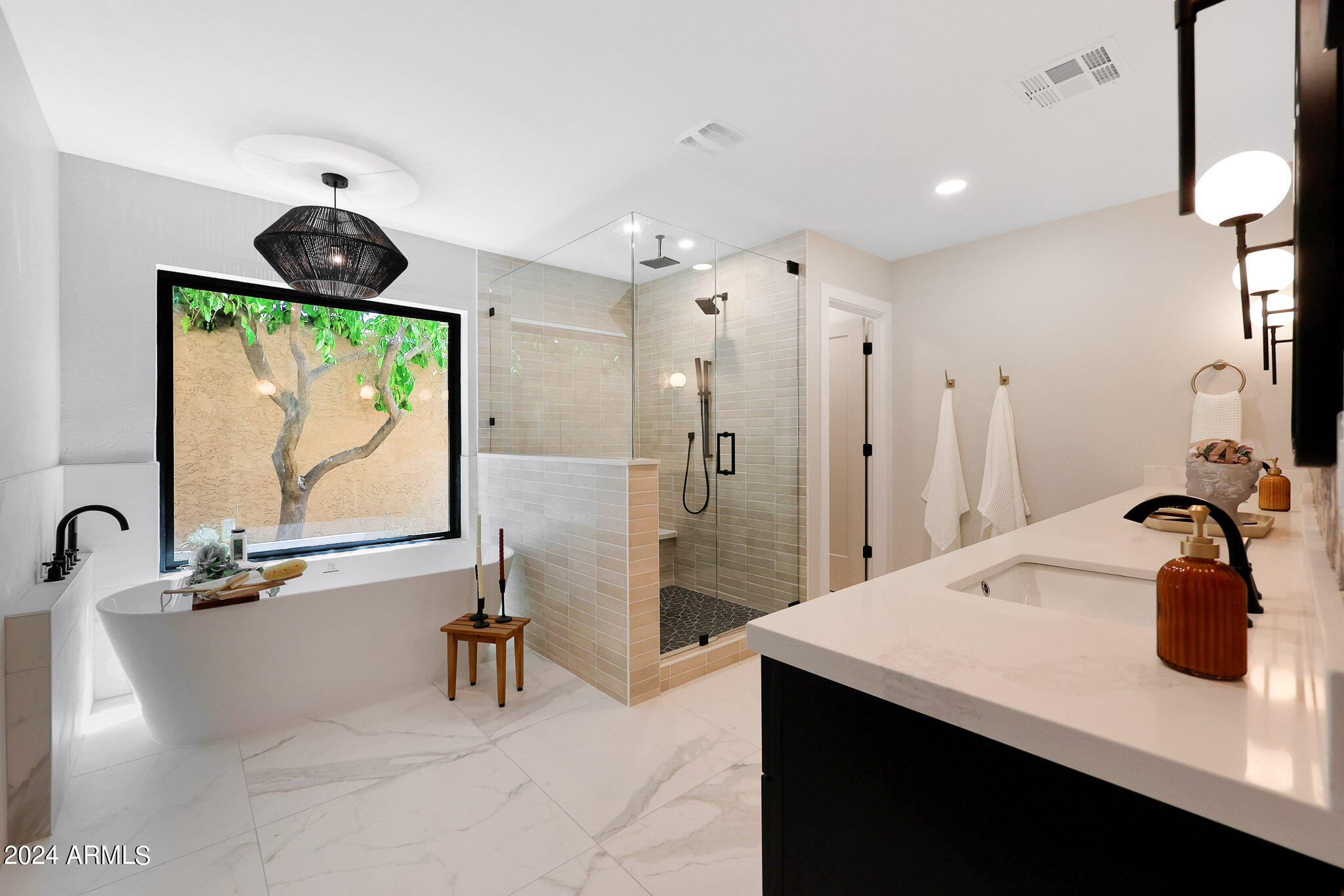 4440 East Camelback Road, Unit 32 Phoenix, AZ 85018 - Photo 30 of 54 a bathroom with a sink and a large mirror