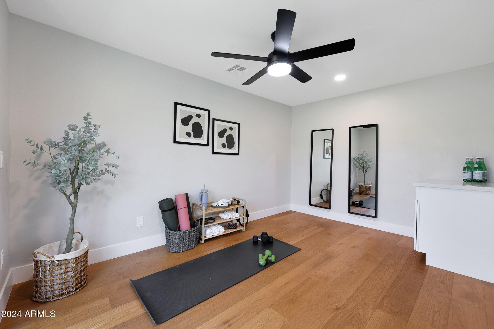 4440 East Camelback Road, Unit 32 Phoenix, AZ 85018 - Photo 35 of 54 a living room with furniture and a potted plant