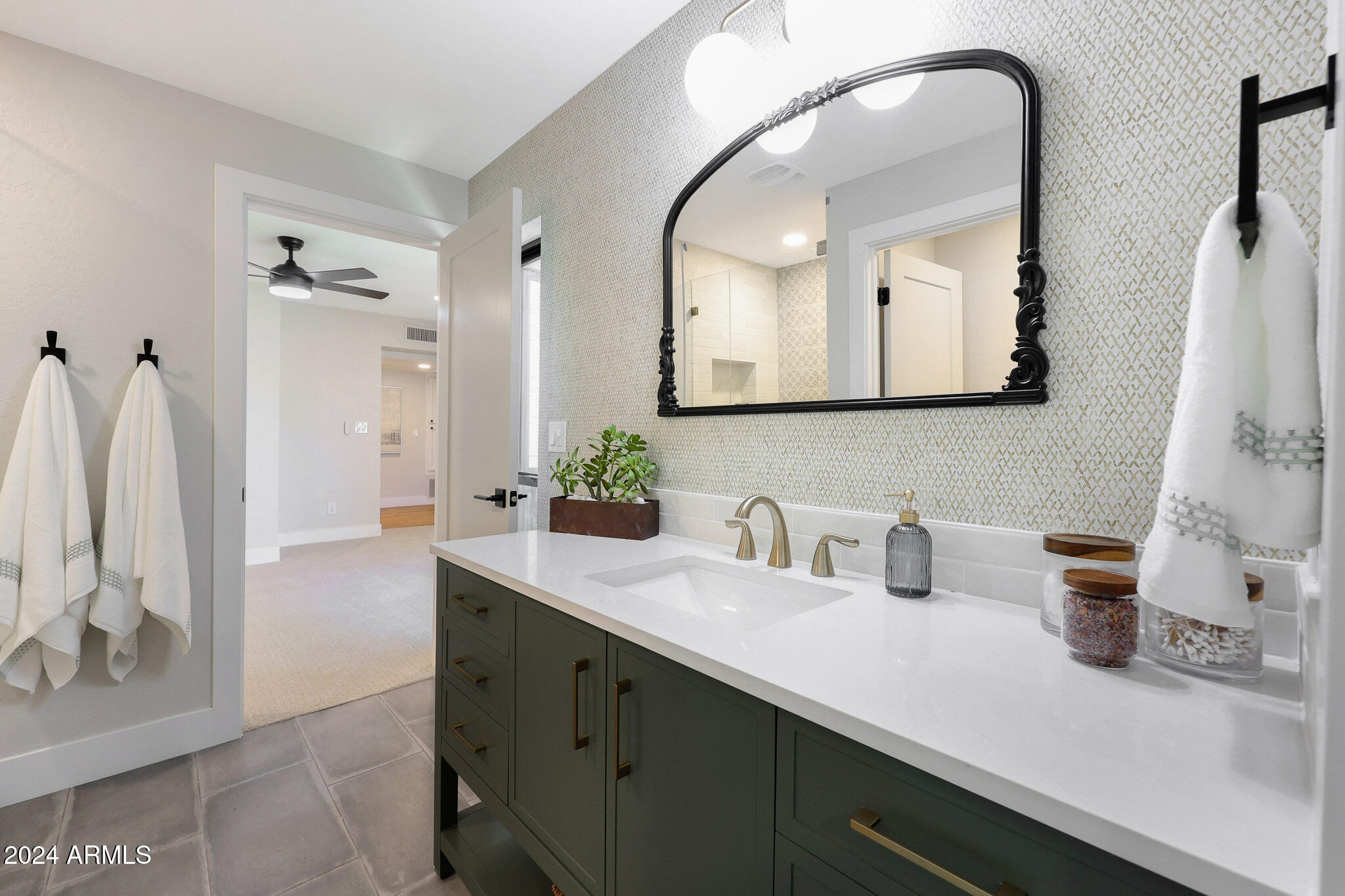 4440 East Camelback Road, Unit 32 Phoenix, AZ 85018 - Photo 38 of 54 a bathroom with a double vanity sink and a mirror