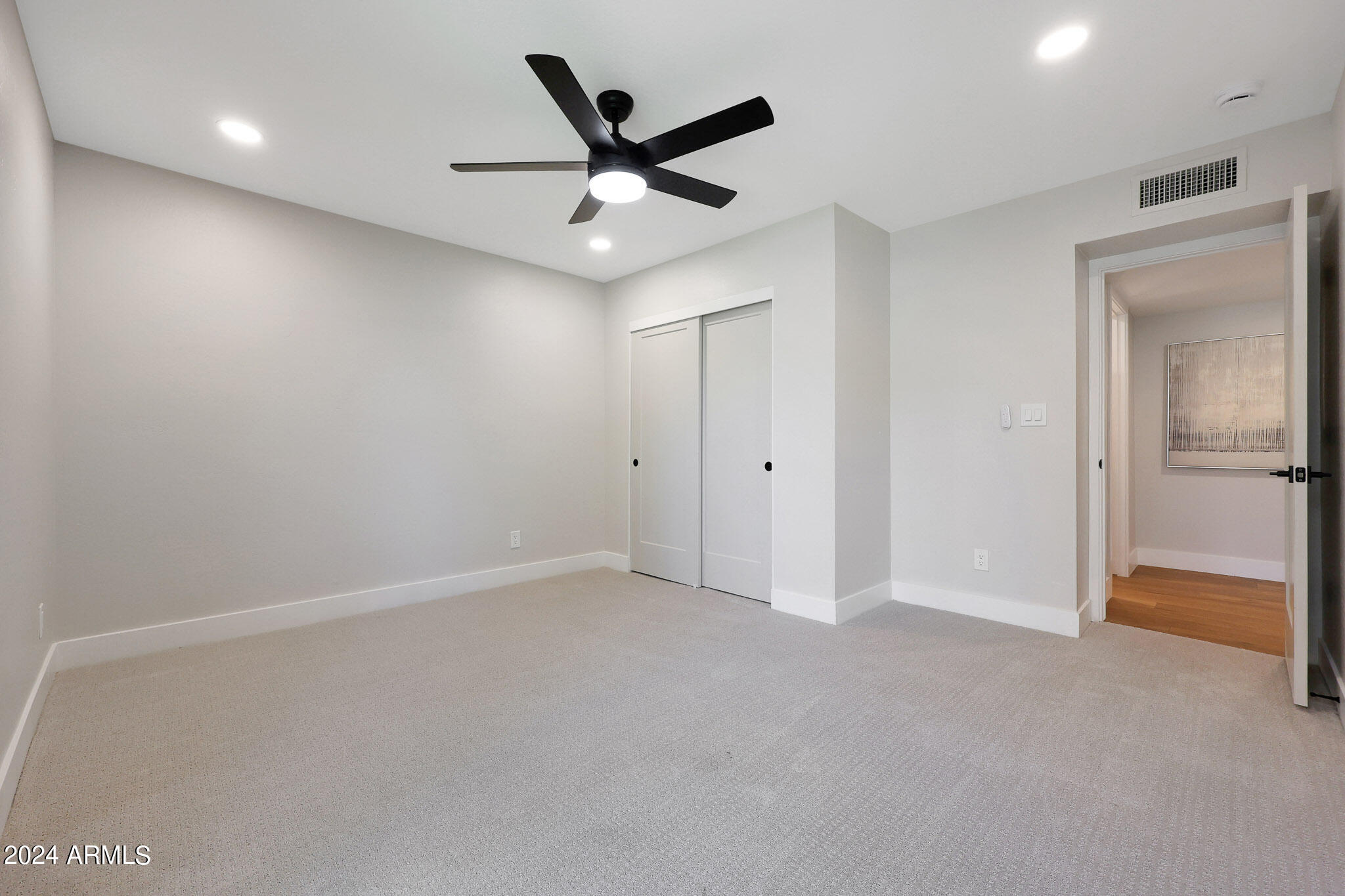 4440 East Camelback Road, Unit 32 Phoenix, AZ 85018 - Photo 39 of 54 an empty room with ceiling fan and window
