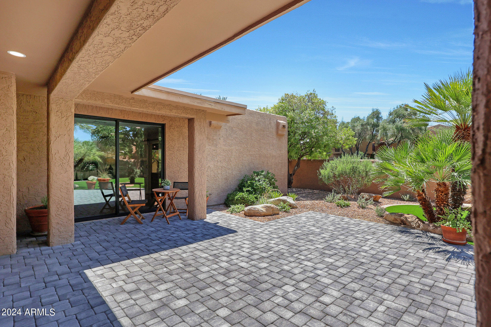 4440 East Camelback Road, Unit 32 Phoenix, AZ 85018 - Photo 42 of 54 a view of a backyard with sitting area