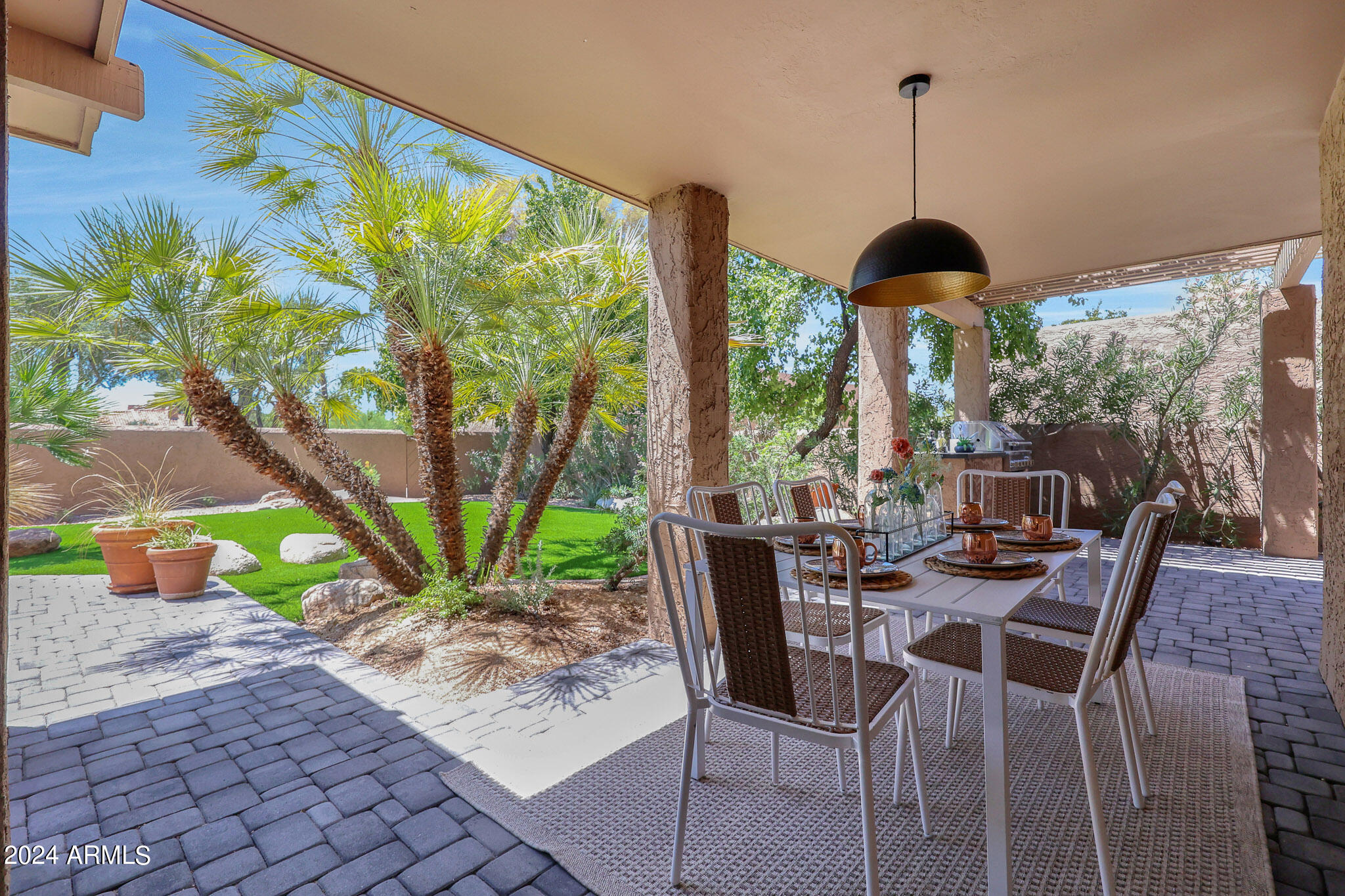 4440 East Camelback Road, Unit 32 Phoenix, AZ 85018 - Photo 47 of 54 a view of a dining room with furniture window and outside view