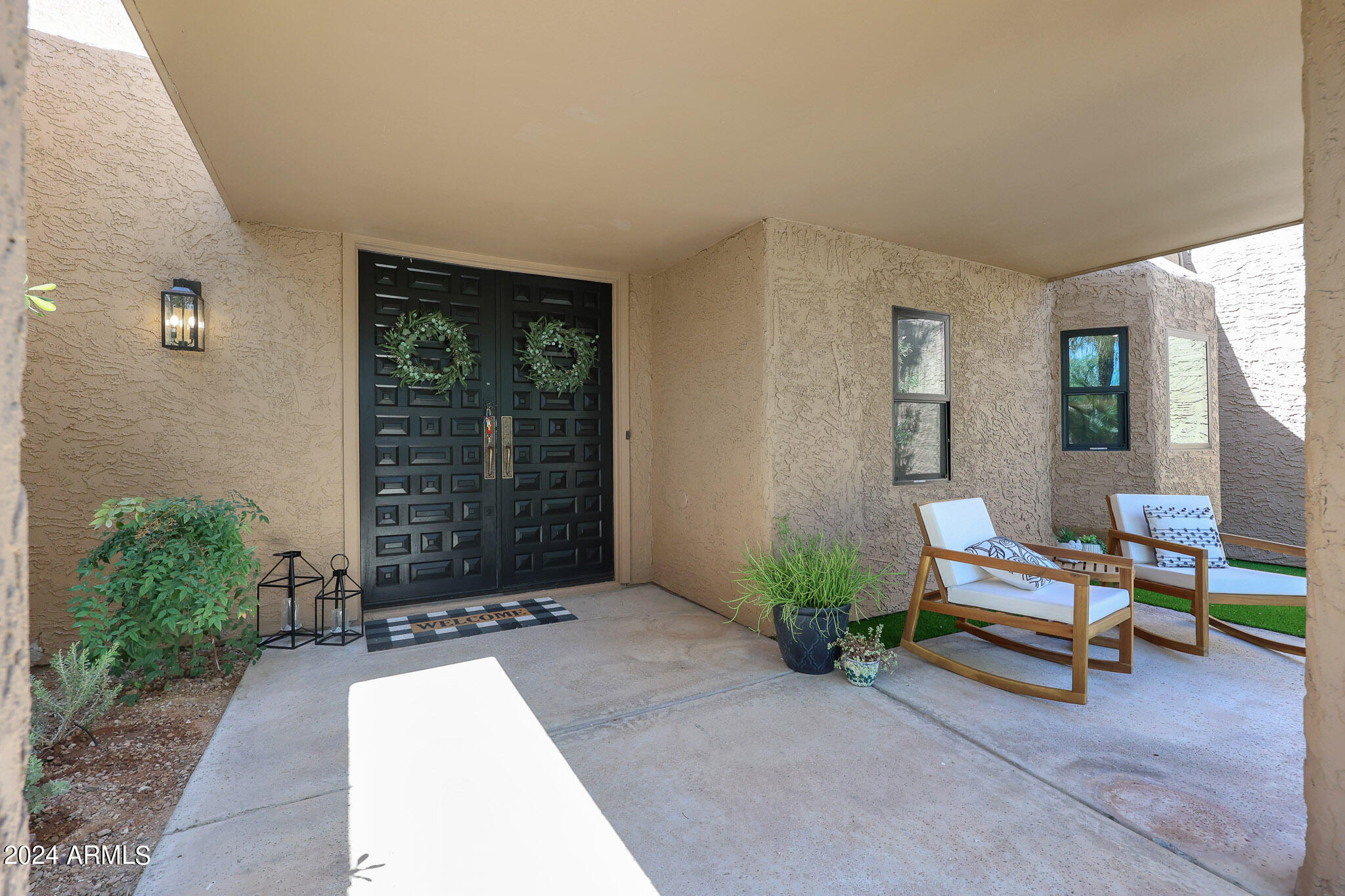 4440 East Camelback Road, Unit 32 Phoenix, AZ 85018 - Photo 7 of 54 a living room with furniture and windows