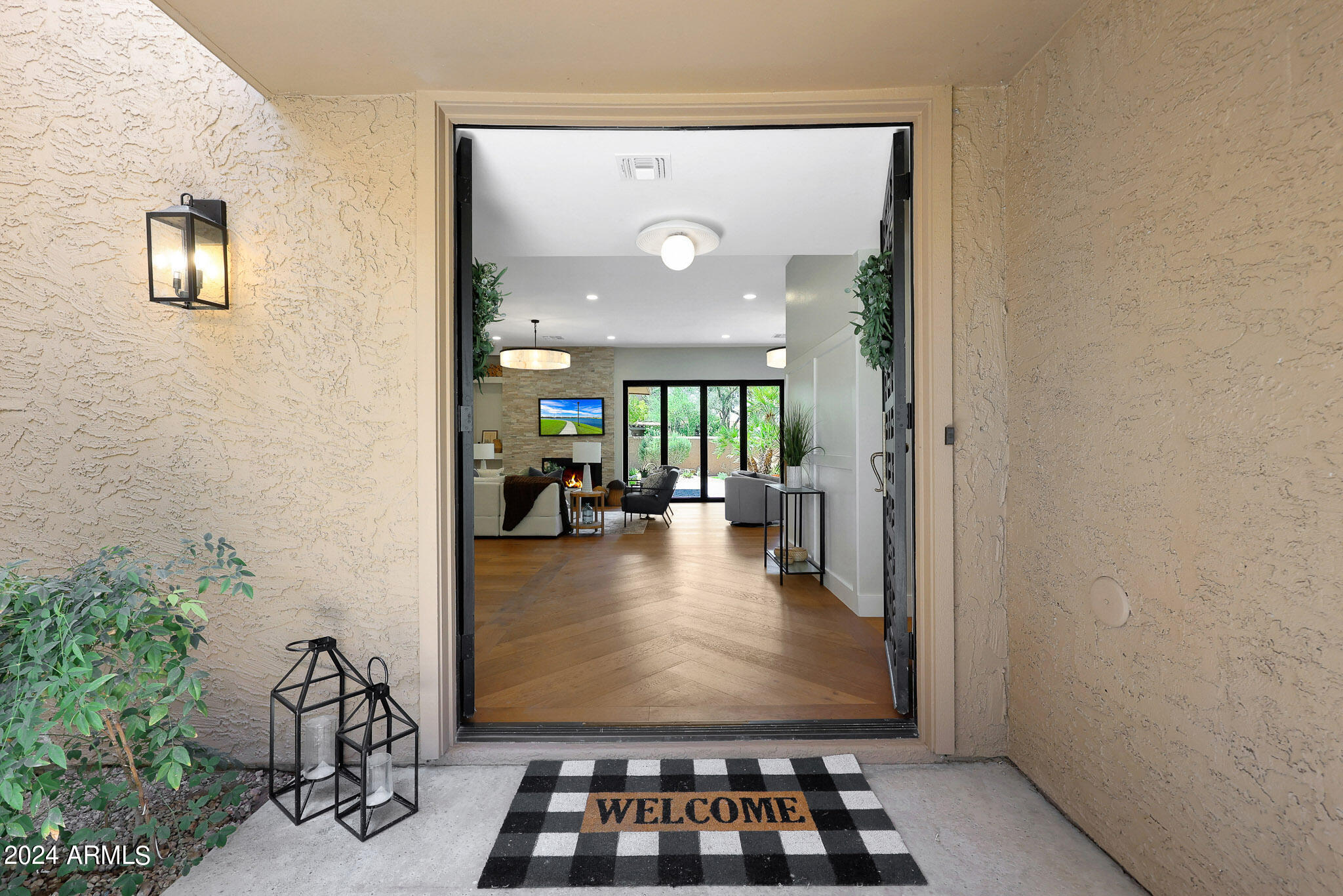 4440 East Camelback Road, Unit 32 Phoenix, AZ 85018 - Photo 9 of 54 view of living room with furniture and a potted plant