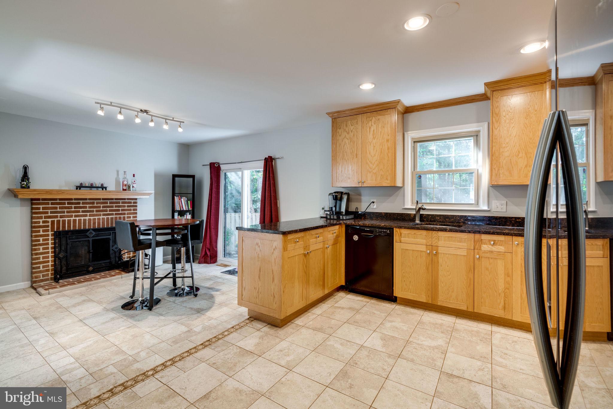 7909 Treeside Court Springfield, VA 22152 - Photo 13 of 35 Kitchen has eat in area w/fireplace