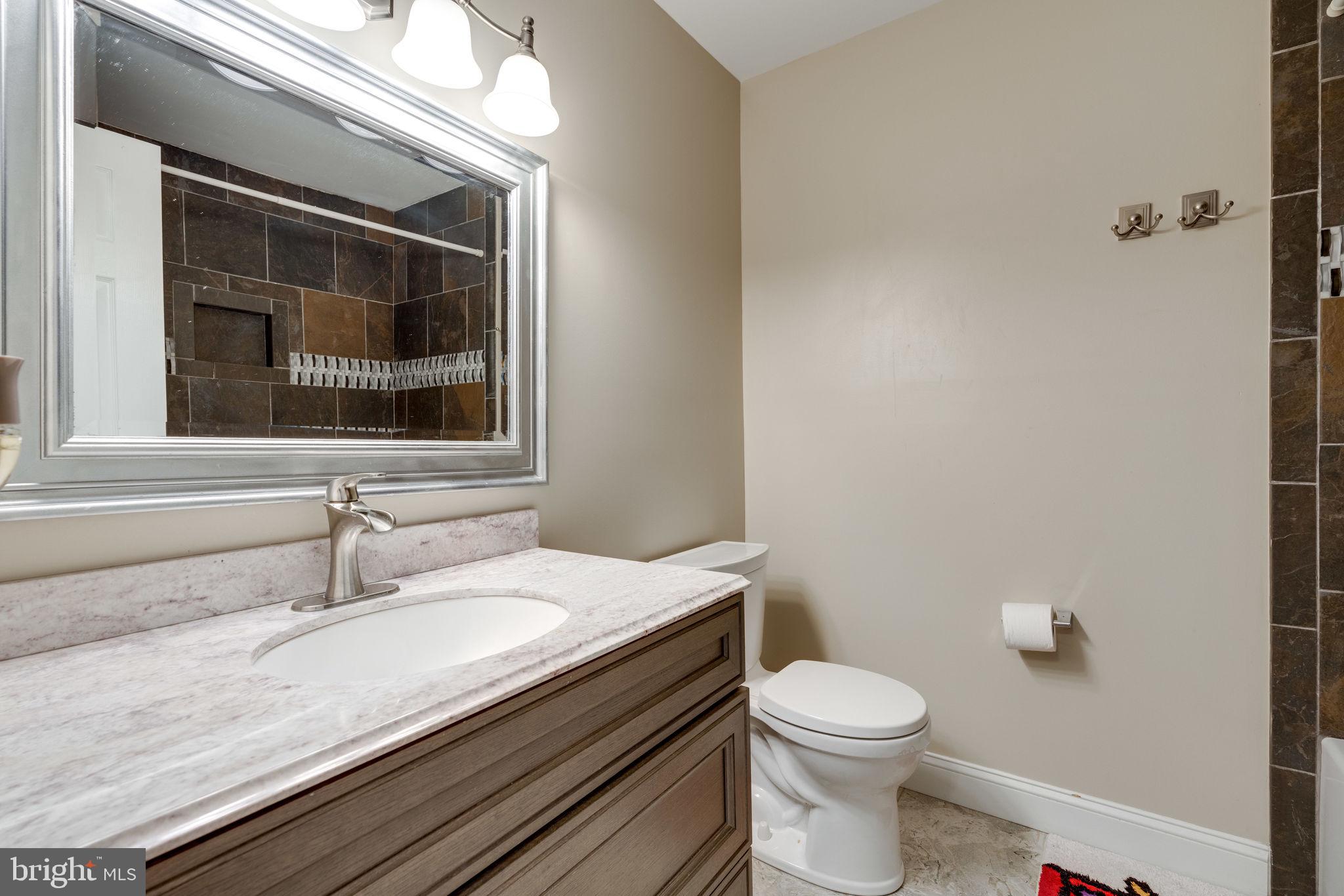 7909 Treeside Court Springfield, VA 22152 - Photo 25 of 35 Updated hall bathroom