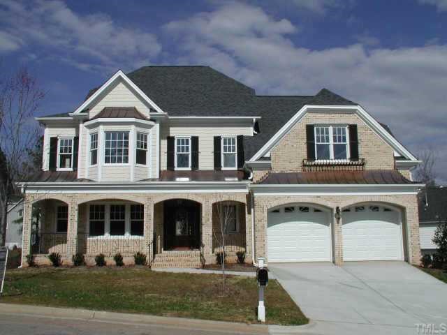 8009 Oneal Road Raleigh, NC 27613 - Photo 1 of 1 a front view of a house with yard and garage