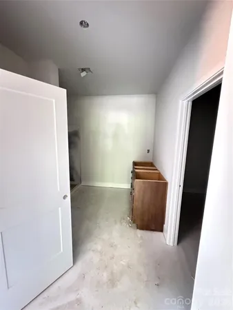 a room with a refrigerator and a stove