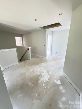 a view of a big room with a fireplace and cabinets