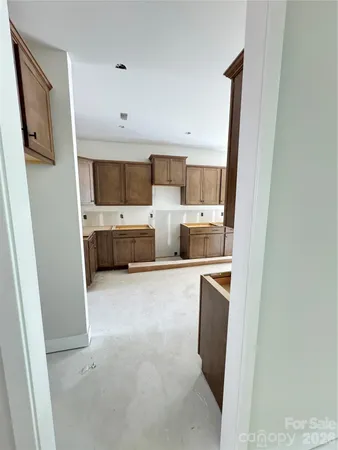 a kitchen with stainless steel appliances a refrigerator and a sink