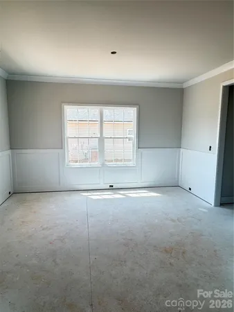 an empty room with a empty space and windows