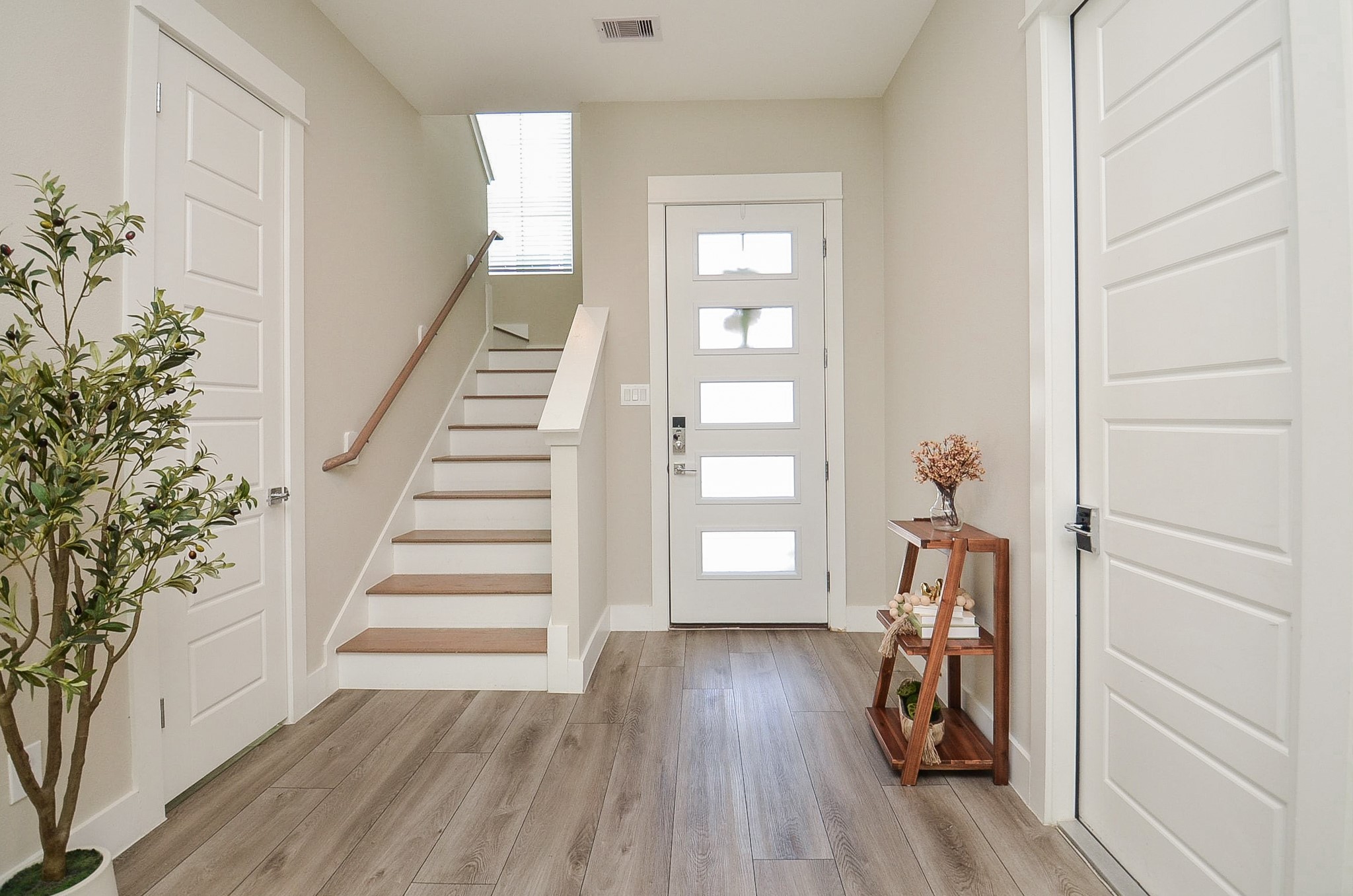 1223 West Tidwell Road Houston, TX 77091 - Photo 8 of 30 A welcoming entry greets you from both the front door and garage, creating a convenient everyday arrival point.
