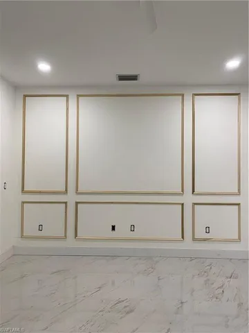 a kitchen with stainless steel appliances a sink and a refrigerator