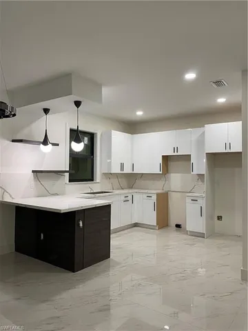 a bathroom with a sink vanity and mirror