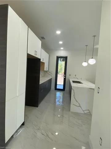 a view of cabinets and wooden floor