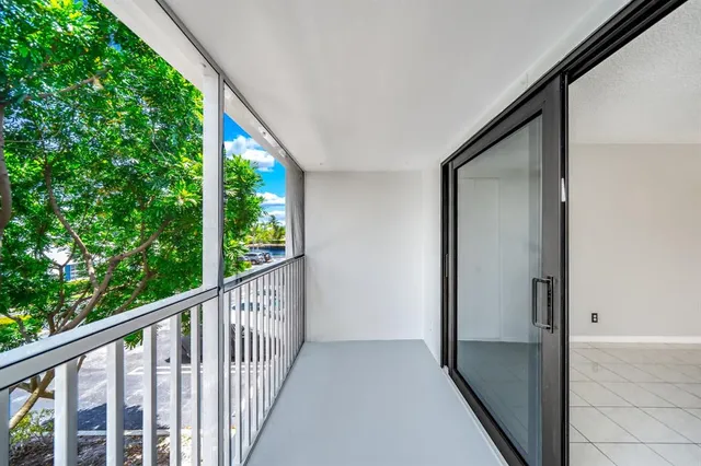 a view of balcony with wooden floor