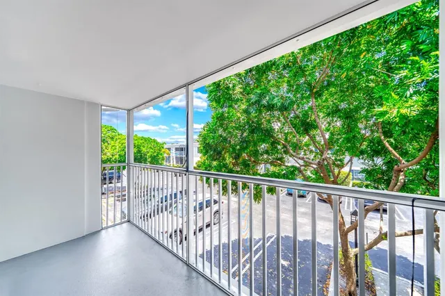 a bedroom with a bed and a potted plant