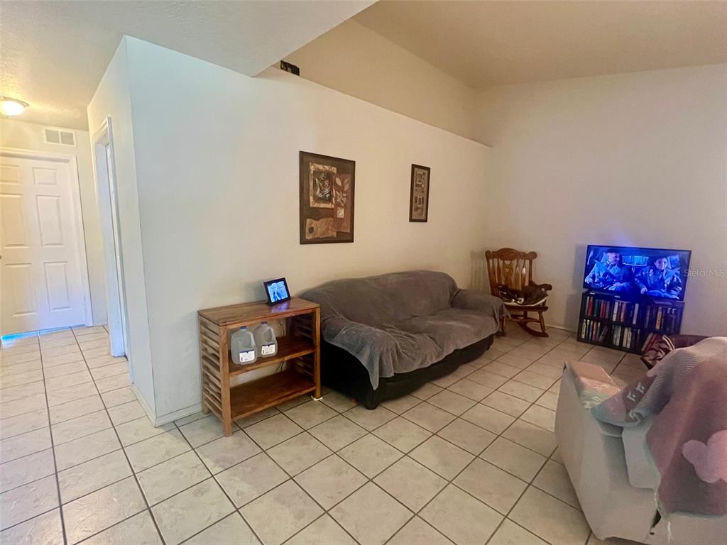 122 Ullian Trail, Unit A&B Palm Coast, FL 32164 - Photo 18 of 32 a bedroom with furniture and a window