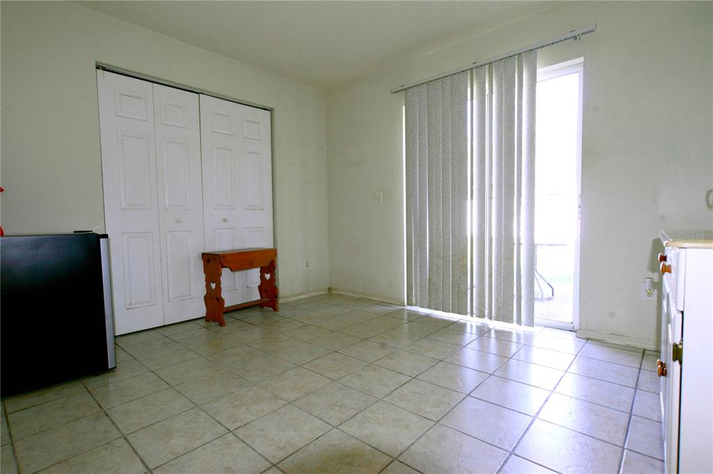 122 Ullian Trail, Unit A&B Palm Coast, FL 32164 - Photo 27 of 32 a view of a room with toys and a window