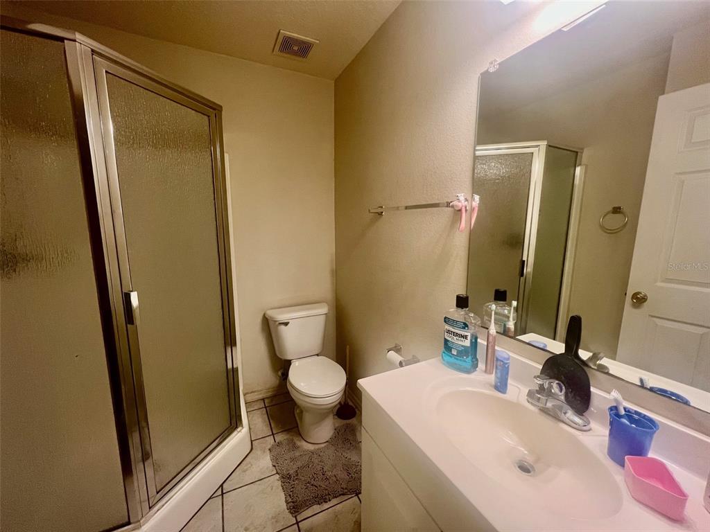 122 Ullian Trail, Unit A&B Palm Coast, FL 32164 - Photo 29 of 32 a bathroom with a sink and a mirror