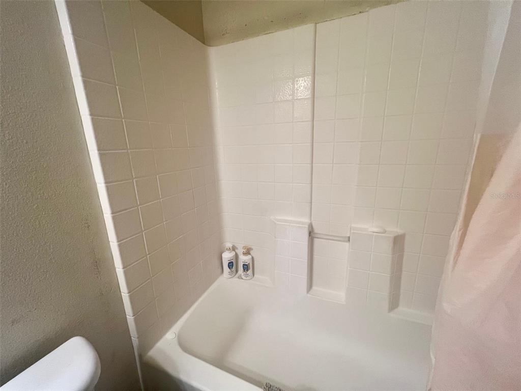 122 Ullian Trail, Unit A&B Palm Coast, FL 32164 - Photo 32 of 32 a white bath tub sitting next to a white toilet