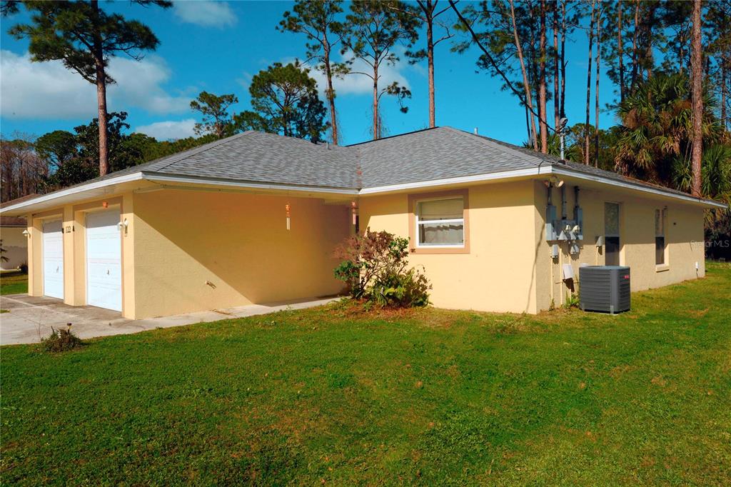 122 Ullian Trail, Unit A&B Palm Coast, FL 32164 - Photo 5 of 32 a view of back yard of the house