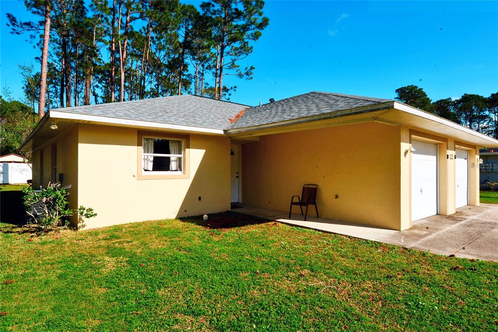 122 Ullian Trail, Unit A&B Palm Coast, FL 32164 - Photo 7 of 32 a view of a backyard