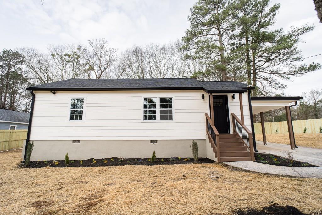 7663 Tara Road Jonesboro, GA 30236 - Photo 1 of 1 a front view of a house with a yard