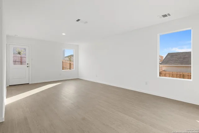 an empty room with windows