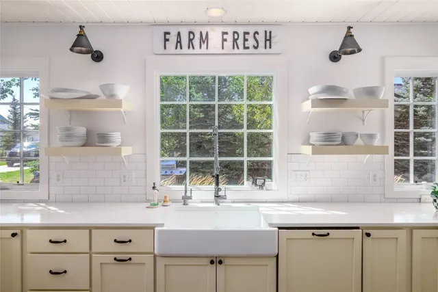 a kitchen with a sink and a window