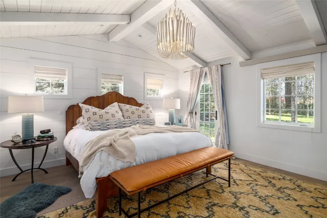 a bedroom with furniture and a window