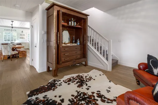 a bedroom with furniture and a rug