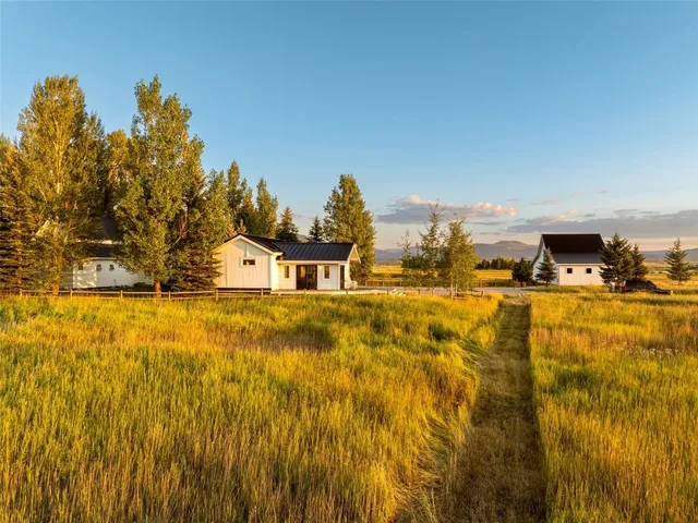 a view of swimming pool with an outdoor seating